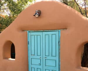 Stucco arch with blue door